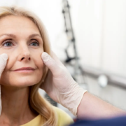 Female patient recovering from a facelift, showing minimal swelling and natural results at Balikian Facial Plastic Surgery