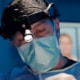 Facial plastic surgeon Dr. Richard Balikian performing a preservation deep plane facelift with advanced precision in the operating room.