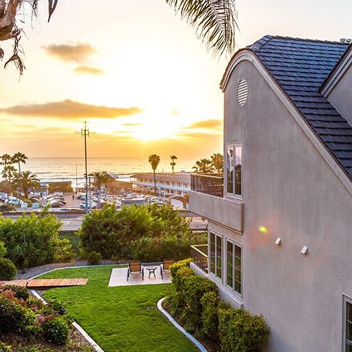 Ocean-view lawn and patio at a private Del Mar Airbnb condo near L’Auberge Del Mar.