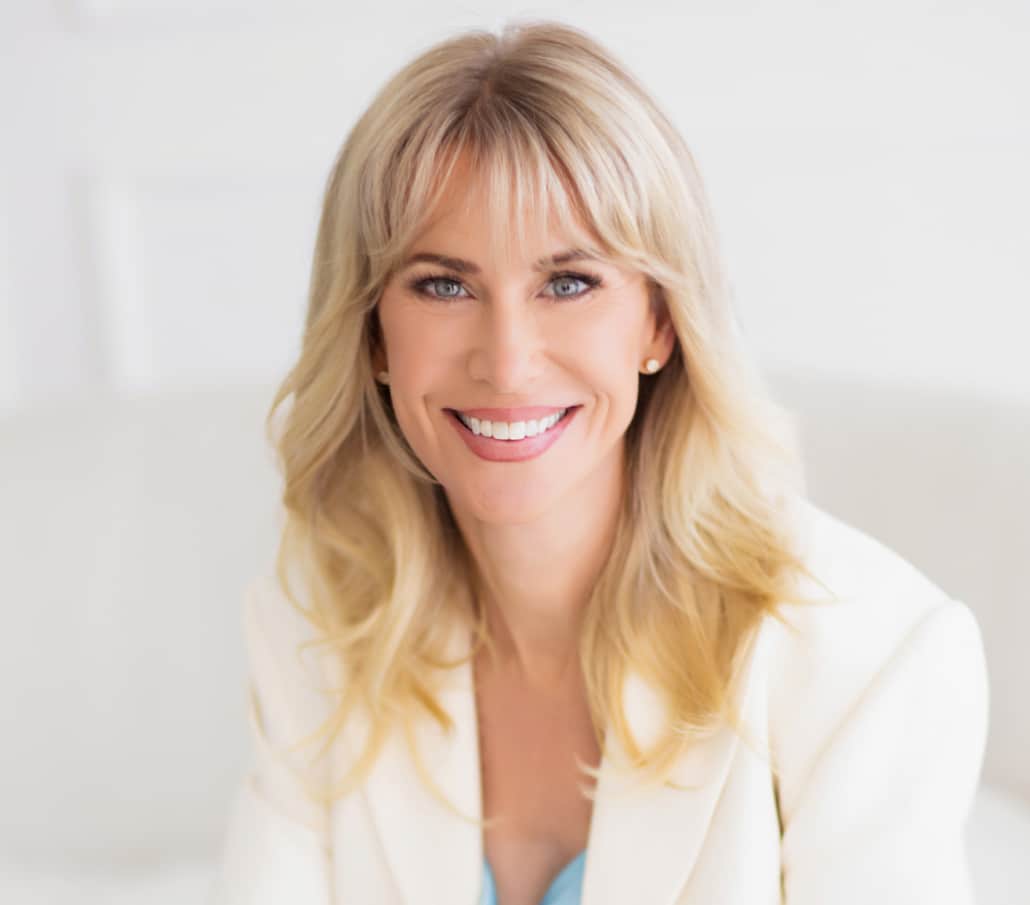 Portrait of a smiling 50-year-old Artiste Lift™ deep plane facelift patient of Dr. Richard Balikian.